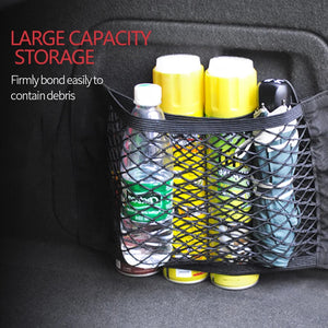 Mesh trunk pocket holding small containers