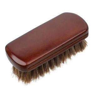 Rounded rectangular handheld brush