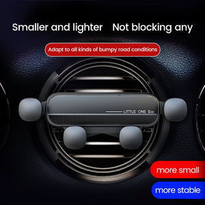 Phone holder displayed over a round car vent