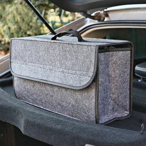Gray felt storage box beside a cargo opening