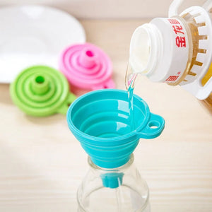 Collapsible funnel pictured over a bottle opening