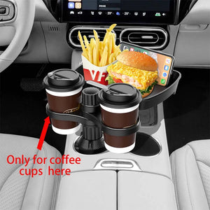 Cup-holder tray positioned beside a center console
