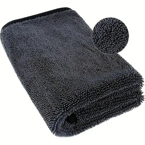 Folded dark-gray microfiber towel with surface-detail inset