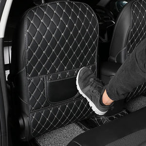 Long seat-back protector positioned against rear-seat foot contact