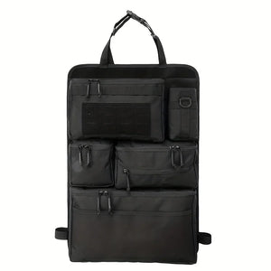 Black seat-back storage panel with top strap