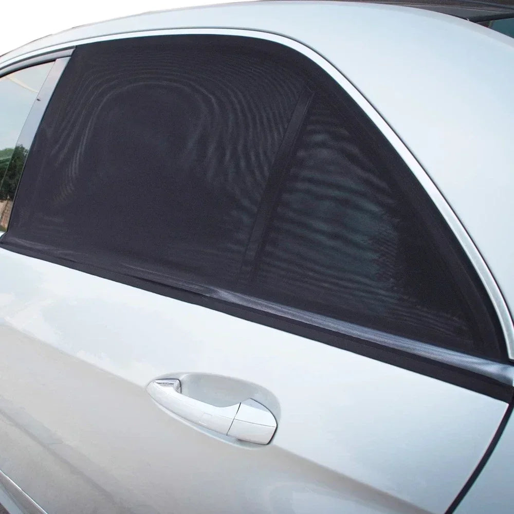 Black slip-over mesh shade fitted to a door-window frame