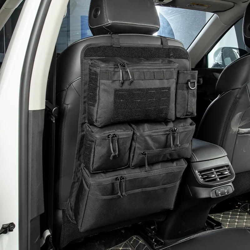 Black hanging storage bags behind car seats