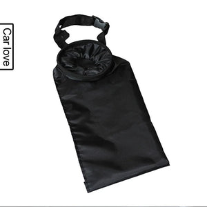 Black hanging fabric trash bag on a white background