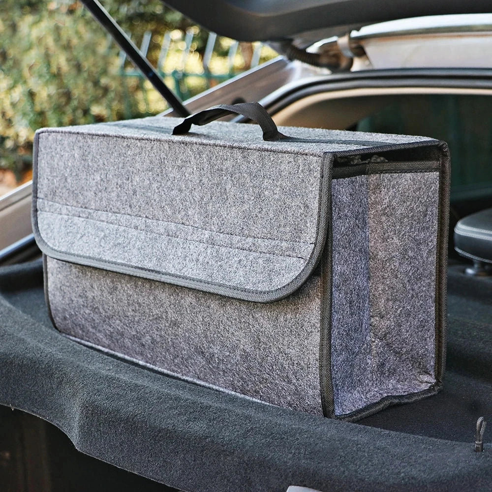 Gray felt storage box beside a cargo opening