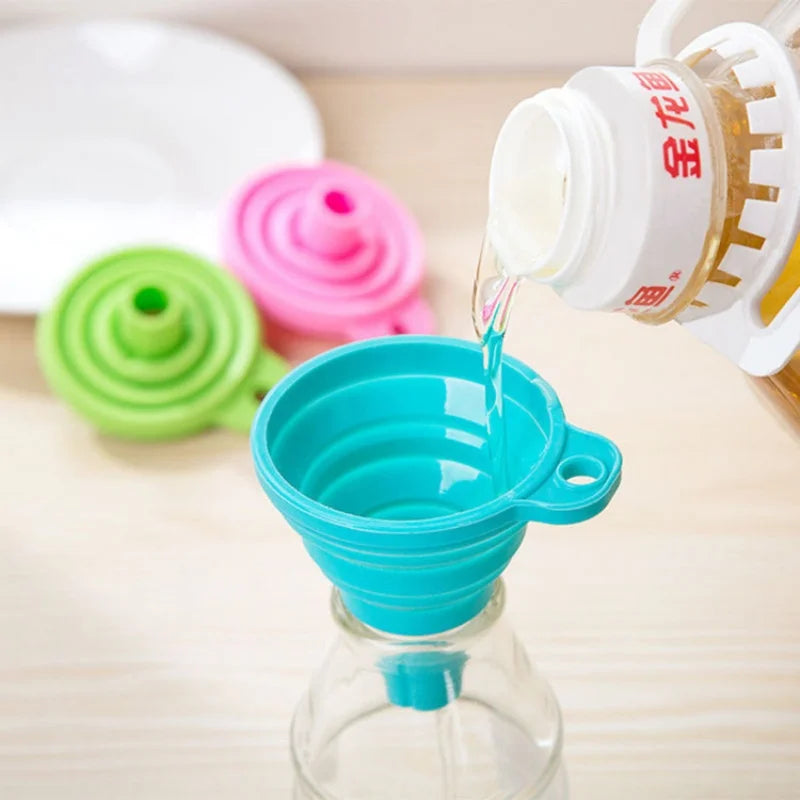 Collapsible funnel pictured over a bottle opening