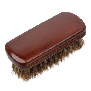 Single rounded brush with dark handle