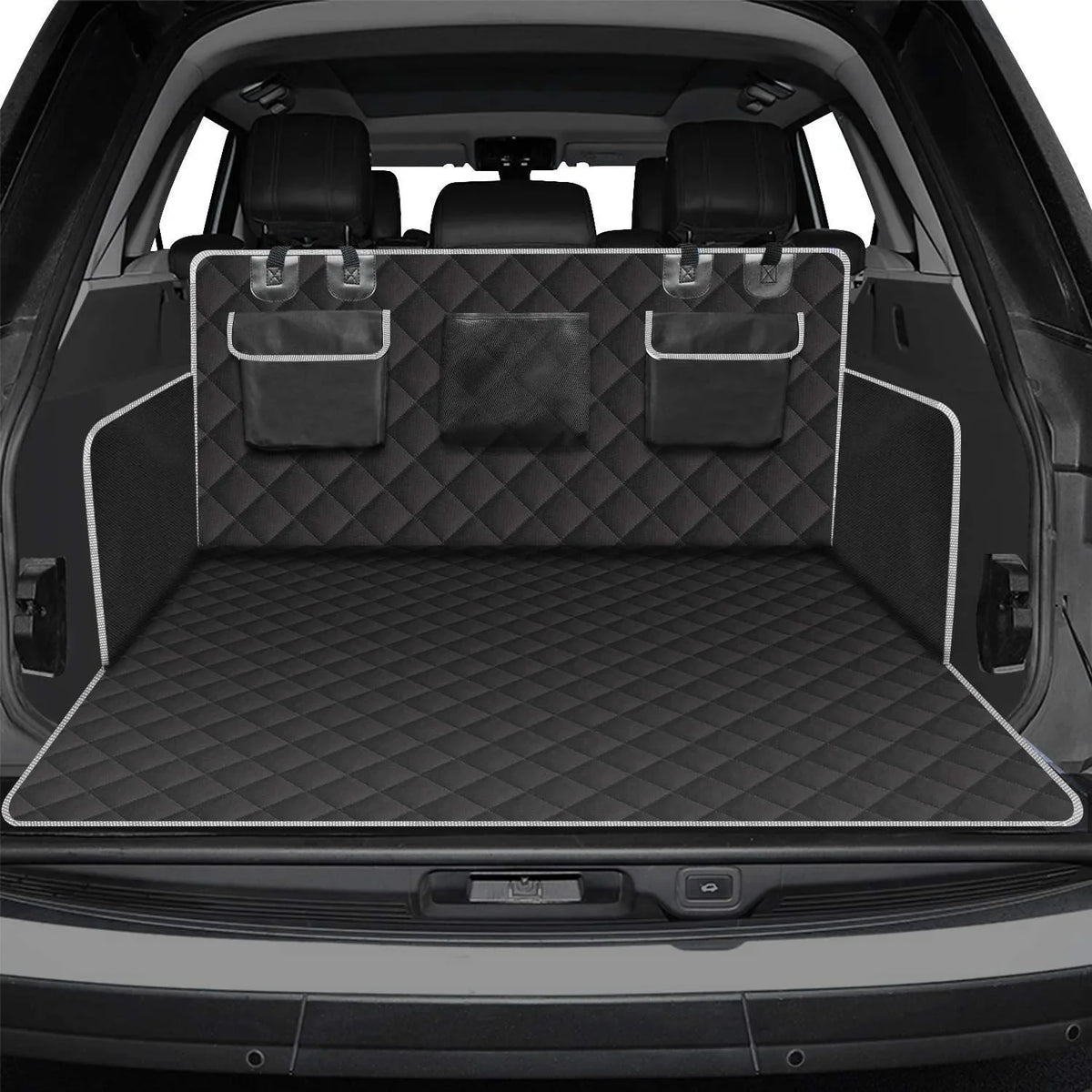 Black cargo liner covering the floor and rear seat backs