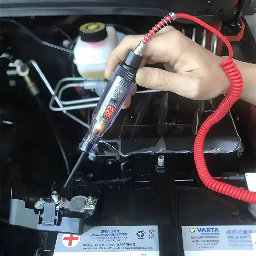 Handheld probe tester illustrated beside a car battery